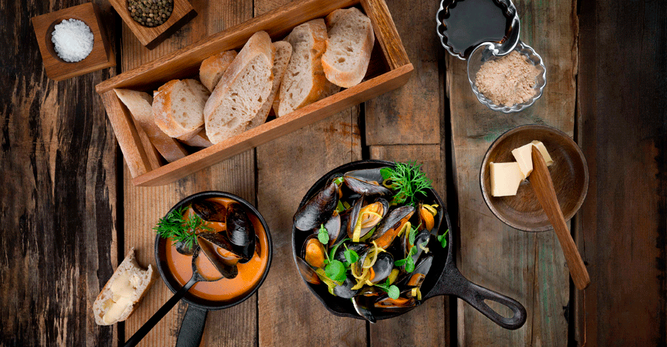 Photo of mussels that have been prepared in a dish.